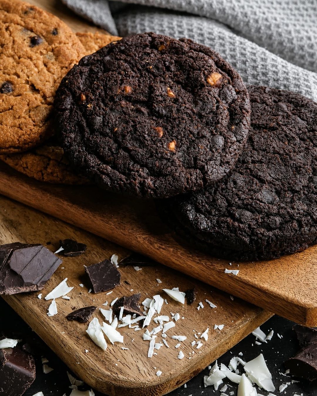 Double chocolate cookies beside chunks of dark chocolate